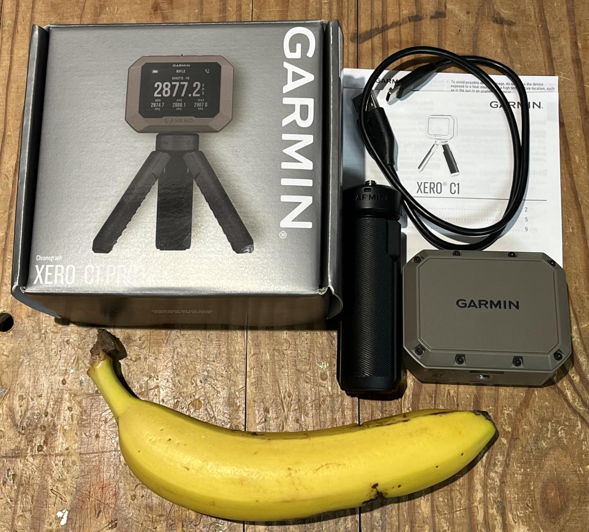 Garmin Xero C1 Pro Chronograph with everything it came with and a banana for scale