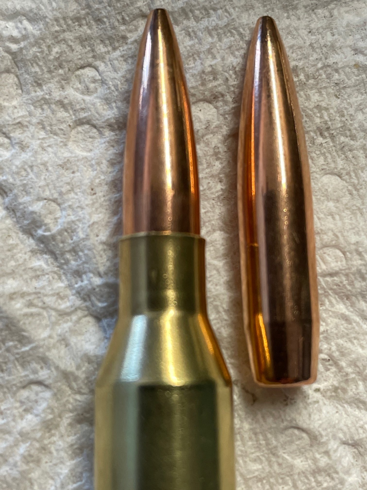 On a rifle cartridge, why are the case mouth and neck on the