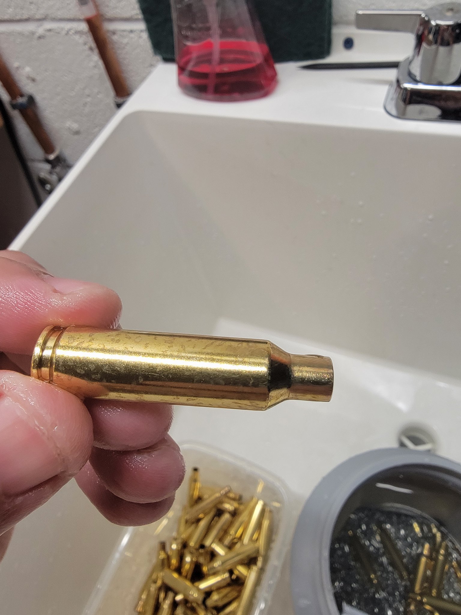 Wet tumble spots on brass