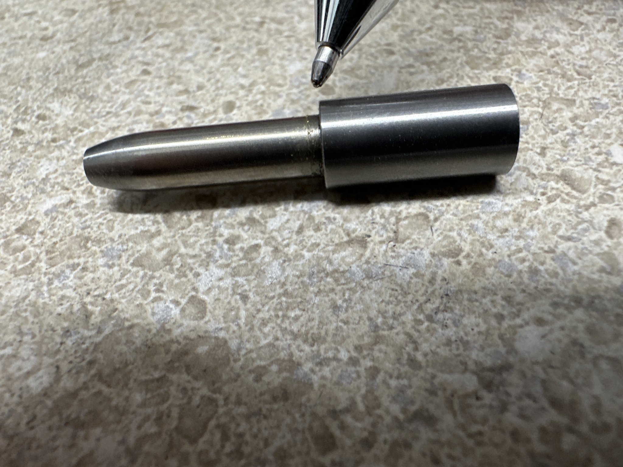 Flare-Shooting Titanium Pen