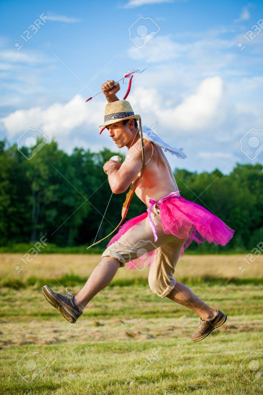 95628901-white-guy-with-wings-on-his-back-he-displays-bow-with-arrow-cupid-on-valentine-s-day-...jpg