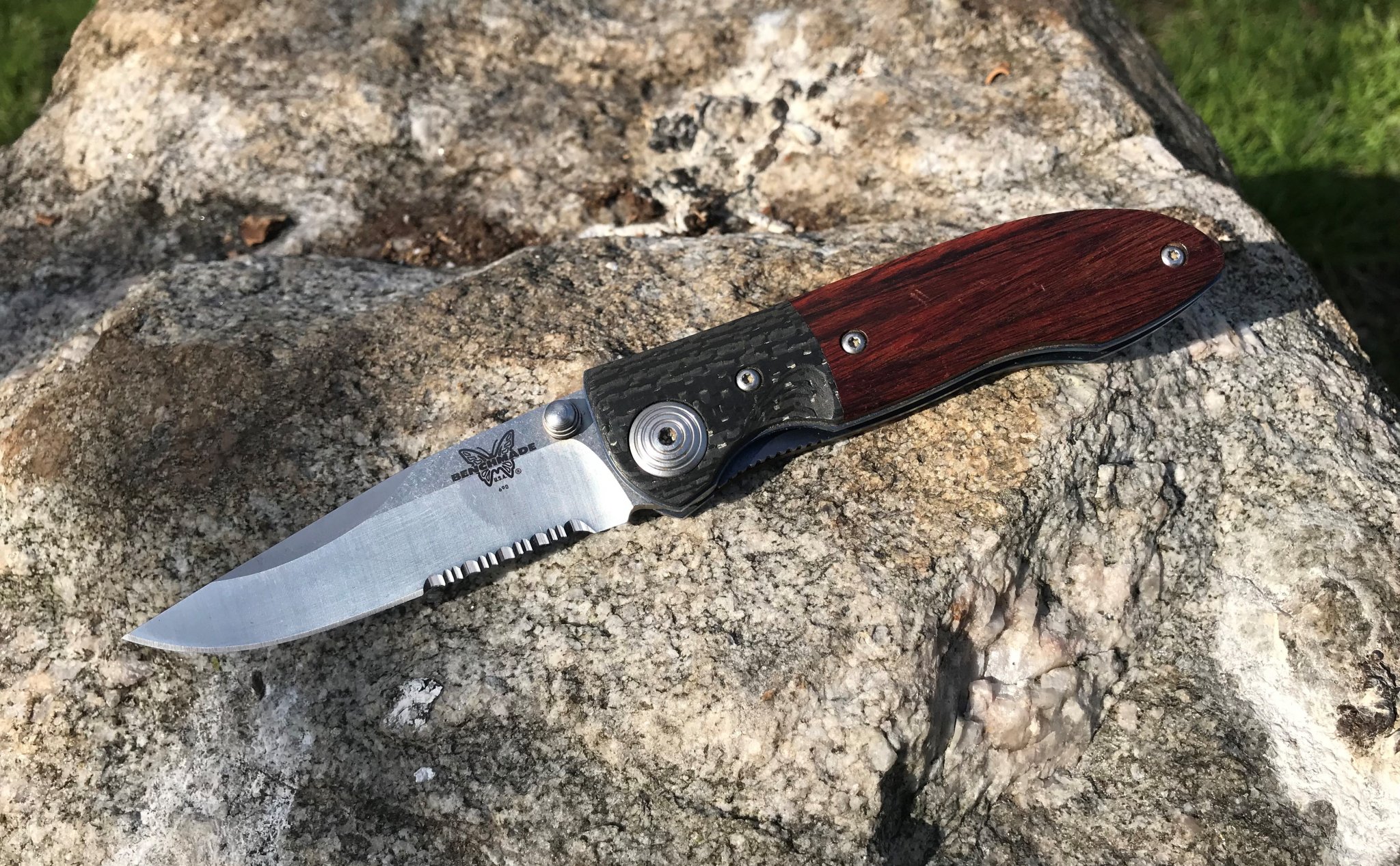 Benchmade Model 690 Elishewitz folder knife of the year 2001on rock.JPG