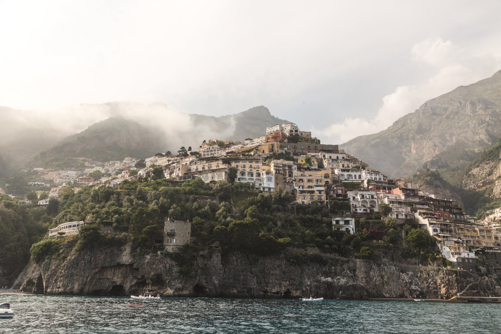 boats-sailing-under-buildings-on-rock-face.jpg